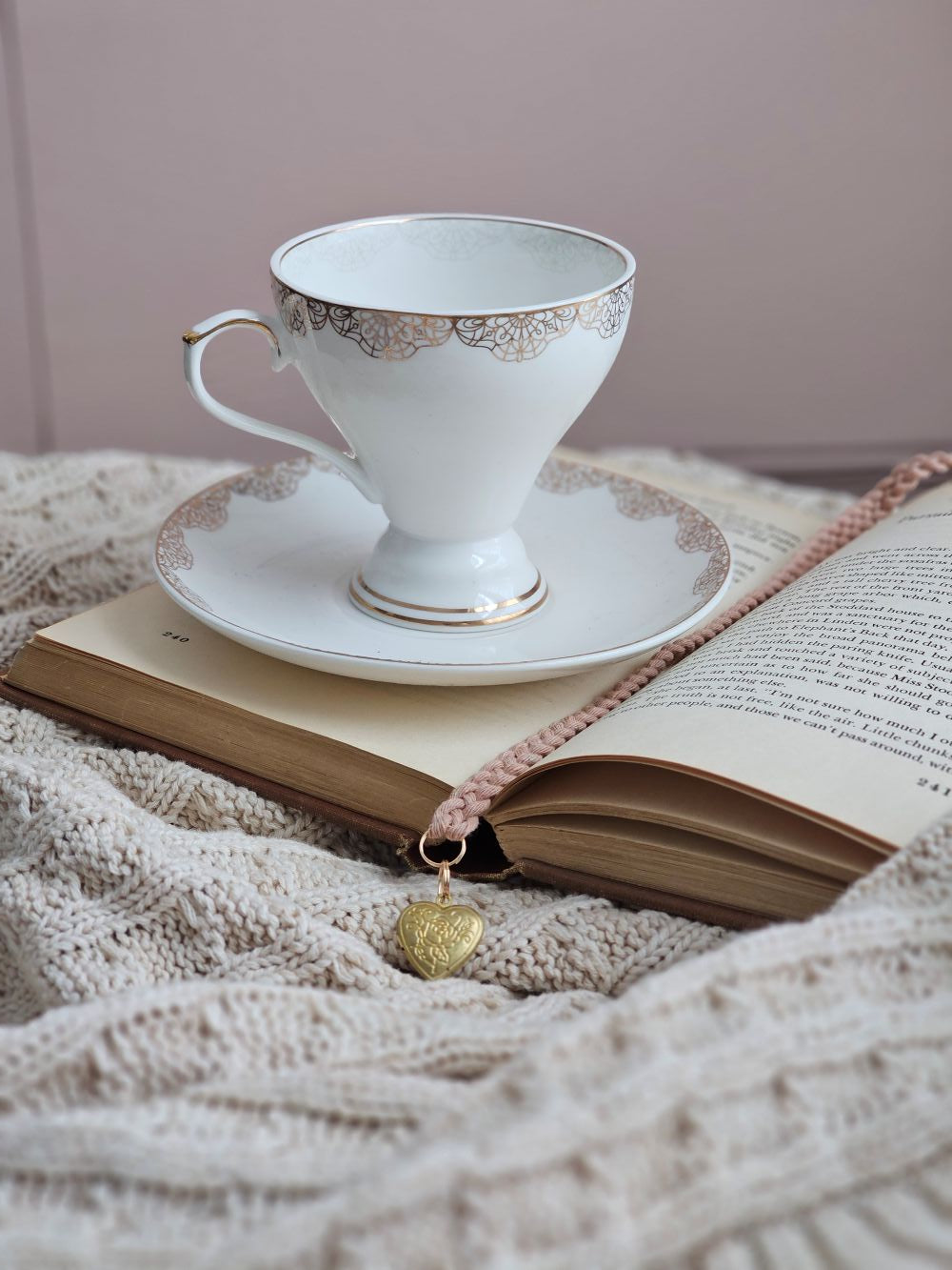 White Porcelain Tea Cup and Saucer with Gold Lace Design